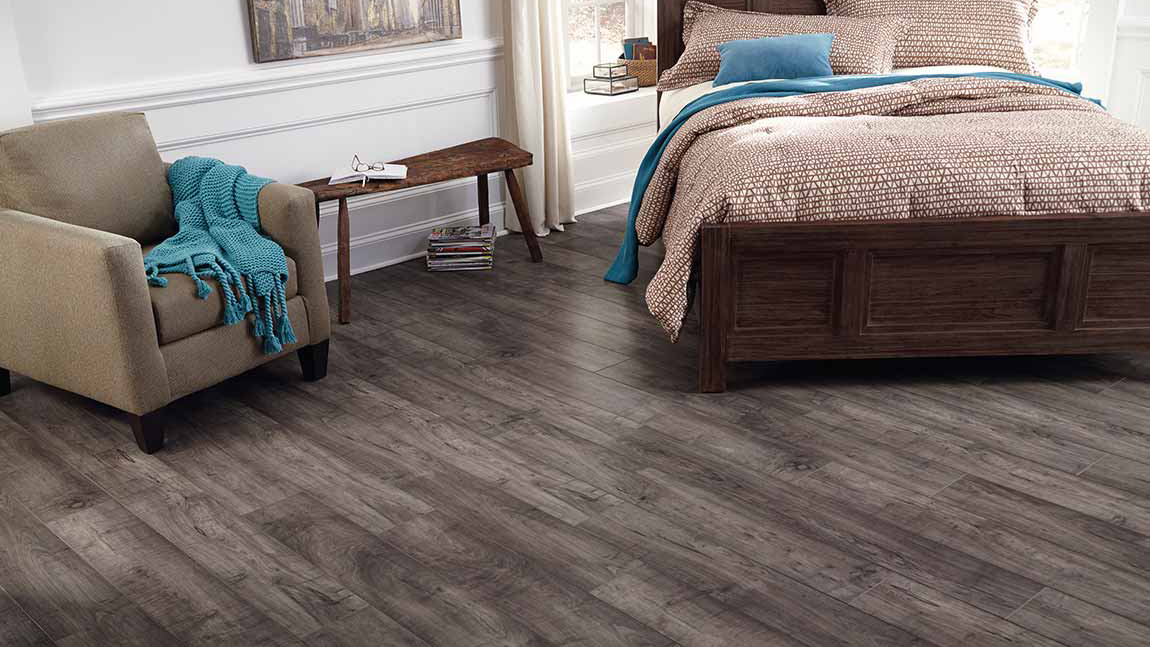 Laminate flooring in a bedroom, installation services available.
