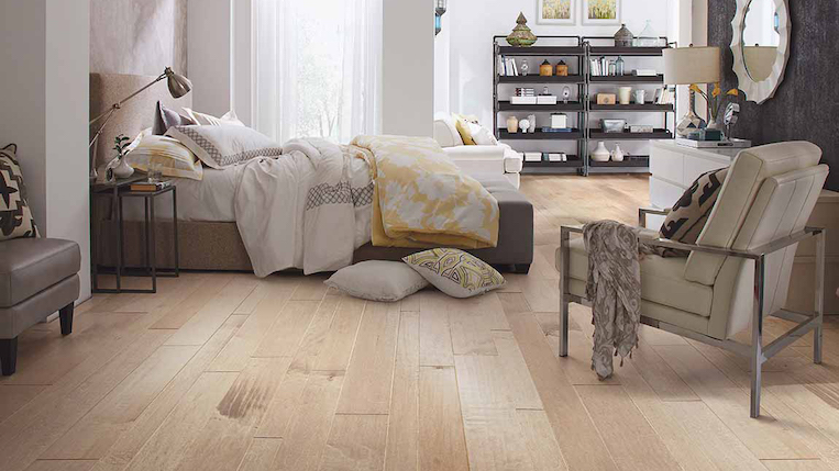 wide plank solid hardwood flooring in a bedroom near Lewes, DE